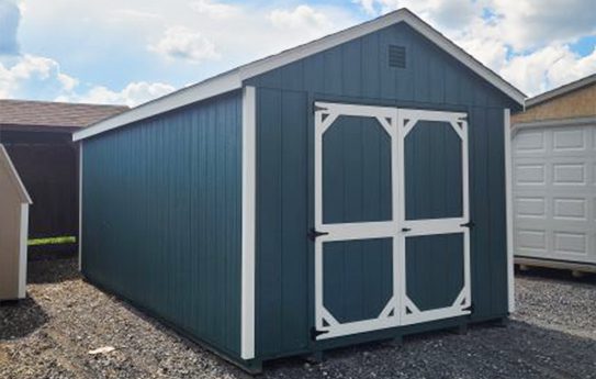 blue shed with white trim
