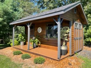 shed with a porch and awning