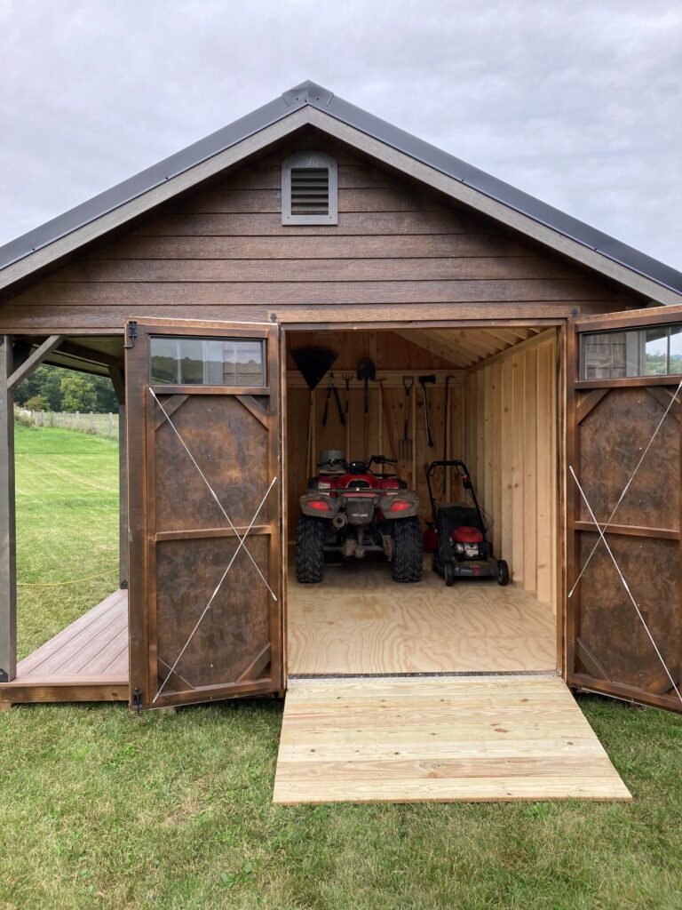 shed with lawn mowers inside