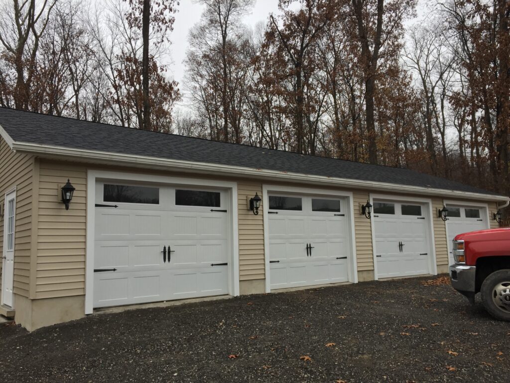 4 car garage tan with white doors
