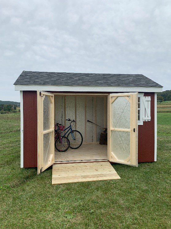 an open shed with bicycles inside